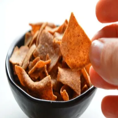 A handful of my baked multigrain chips. These are seasoned just right and provide a satisfying crunch, making them a great alternative to fried potato chips.