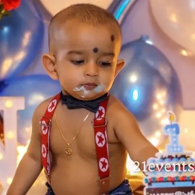 A classic cake smash moment! I can provide a simple setup to capture this fun first birthday tradition.
