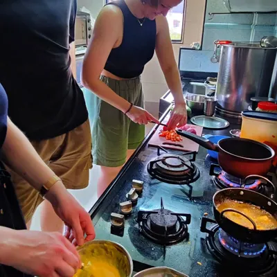 Everyone gets involved in the prep work. Here, guests are learning to chop vegetables for a traditional Maharashtrian dish during one of my hands-on cooking workshops in Mumbai.