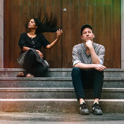 A moment captured with my long-time collaborator Andi Otto. Our partnership is built on musical exploration, fusing my Kannada vocals with his unique electronic cello work.