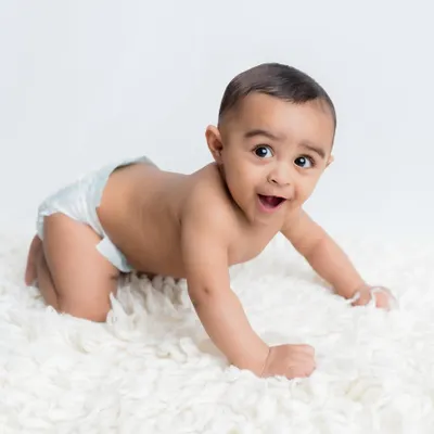 Look at that curious expression! This is from a "sitter session," perfect for babies around 6-9 months who can sit up but aren't yet on the move.