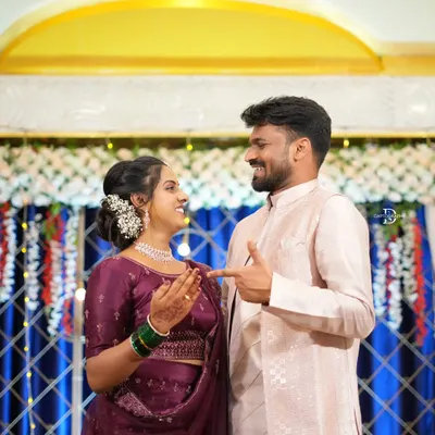 A playful, candid shot of a newly engaged couple sharing a laugh. These are the unscripted moments that truly define your celebration.