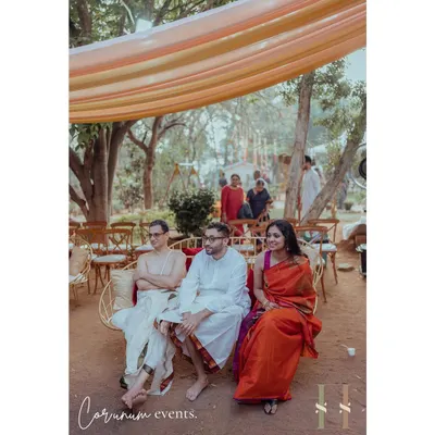 Guests enjoying the intimate setting of a backyard Tamil wedding. The decor was kept simple with light drapes to create a warm, enclosed feel.