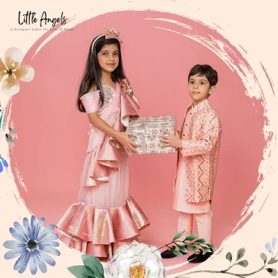 Here is an example of a coordinated sibling set I created for a wedding. The boy wears a peach brocade jacket and kurta, perfectly complementing the girl's matching peach ruffle saree gown.