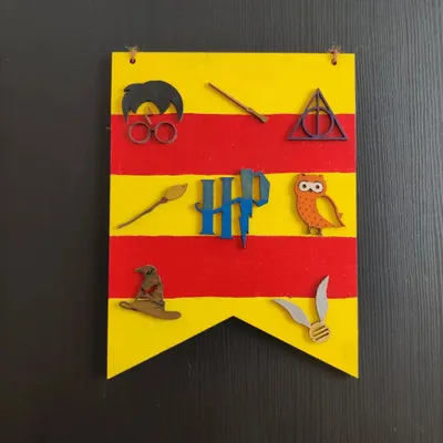 A finished Harry Potter banner, created from one of my themed DIY kits. This is a fantastic activity for a magical birthday party, letting every little wizard create their own flag.