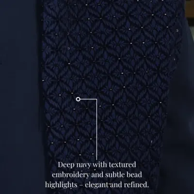 A close-up of the deep navy fabric used in my Indo-Western sets. The textured embroidery and subtle bead highlights create a refined and elegant finish.