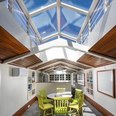 We turned a dark, disused attic in a 1920s building into this vibrant, light-filled workspace for staff. The addition of a central skylight was key to making the once dingy attic a functional and inspiring office space.