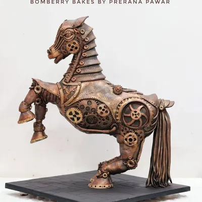 My masterpiece that won Gold at Cakeology 2023. This Steampunk Horse is a fully structured and sculpted cake, showcasing intricate gear work and metallic finishes, all handcrafted.