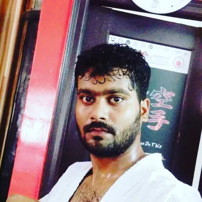 A photo of me, Susheel Colvin, after a training session at the dojo. I am here to personally guide you through every drill, technique, and competition.