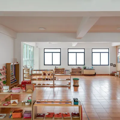 A view of our bright, open, and orderly classroom. The low shelves with accessible materials invite children to explore and choose their own work, fostering independence.