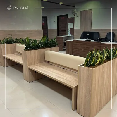 This is my custom-designed seating for a healthcare facility. The benches have integrated planters, seamlessly blending furniture and nature to create a waiting area that is functional, beautiful, and calming.