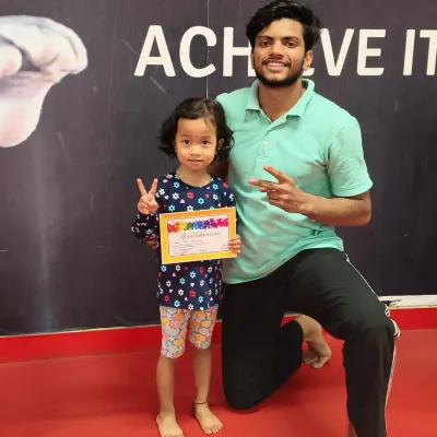 A proud moment! We love celebrating our students' achievements with a certificate to mark their progress.