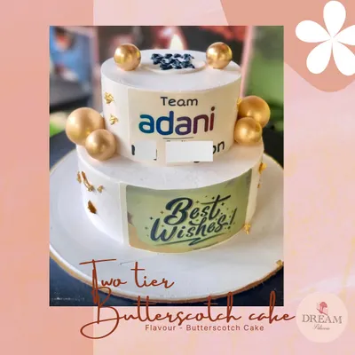 A two-tier butterscotch cake we delivered for a corporate celebration at Adani. We can incorporate company logos and branding for any office event.