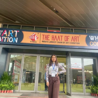 Standing outside 'The Haat of Art', India's largest chain of art exhibitions. Participating in events like this is a dream come true and allows me to share my creative vision with a wider audience.