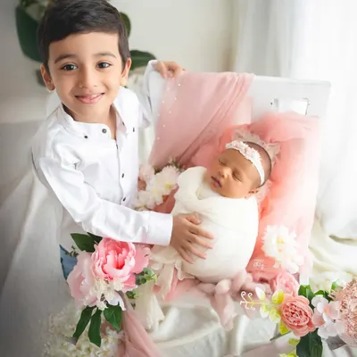 The beginning of a lifelong friendship. I love capturing the pride and gentle curiosity of a big brother meeting his new baby sister, preserving this precious milestone for your growing family.