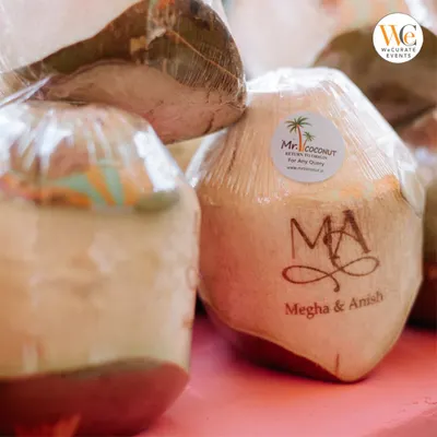 A close-up of our custom hot-stamped coconuts for Megha and Anish's wedding. This unique touch provided guests with a refreshing welcome drink and a personalized keepsake.