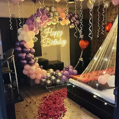 This is the kind of spectacular birthday surprise I can create for your special someone. Imagine their face when they walk into a room filled with a stunning balloon arch, a romantic cabana bed lit with fairy lights, and a path of rose petals.