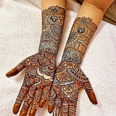 A fresh application of a heavy, detailed design suitable for any grand celebration. Notice the clean linework and the mix of traditional motifs with modern shading techniques for a standout look.