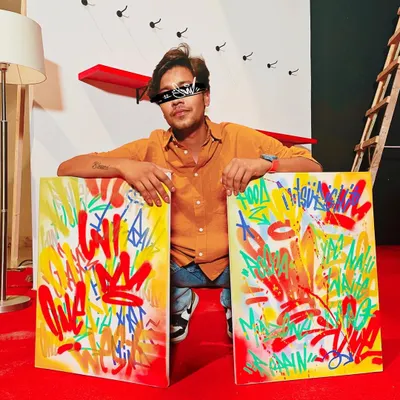 Me with a couple of abstract graffiti canvases I made for the Uni-ball campaign. These pieces are all about color, movement, and the raw energy of street writing, refined for an indoor space.