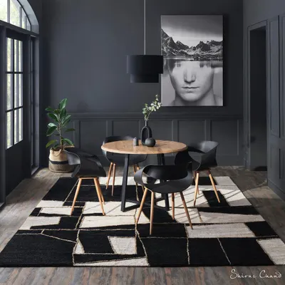 A moody and sophisticated shot for a floor fashions brand. The entire room was styled to complement the bold, geometric design of the rug, making it the undeniable centerpiece of the space.