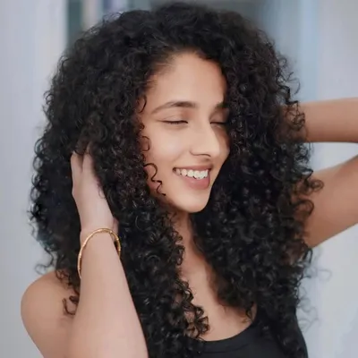 Curls that bounce, radiate, and shine with every turn. We specialize in dry-cutting techniques for curly hair to create the perfect shape.