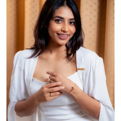 I was so proud to see Sapthami Gowda accept her award for 'Kantaara' in this white cape gown I designed. White is a special color for her character, and creating this powerful, elegant look for her was a memorable experience.