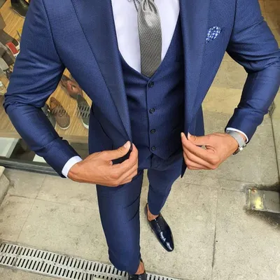 I also specialize in formal wear. This is a perfectly tailored three-piece suit in a striking shade of blue that I can create for your formal events or wedding receptions.