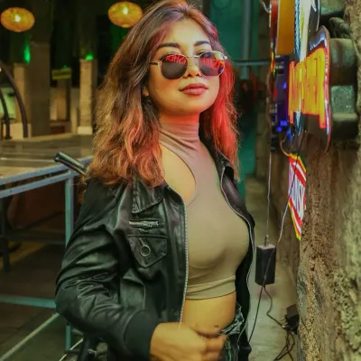A stylish shot against a neon-lit background. I love edgy, cool aesthetics that match my music and personality.