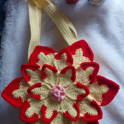This flat-lay of the Lotus Bag shows the vibrant colors and the 3D construction of the flower petals. I provide feedback to ensure patterns are easy to follow, even for complex designs like this.
