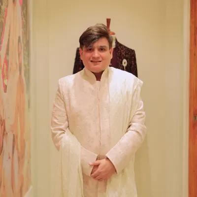 Presenting a look from the 'Baarat' collection by Tasva. This elegant sherwani in a subtle off white is a perfect example of modern Indian menswear, blending traditional silhouettes with contemporary comfort and style.