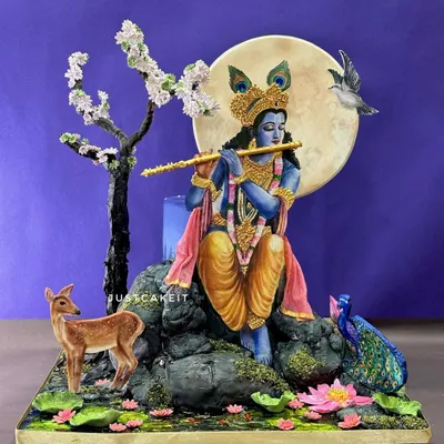 This hand-painted cake, depicting Lord Krishna playing his flute, was a meditative process that took 12 days to create. Every element, from the serene expression to the enchanted animals, is edible and hand-crafted.