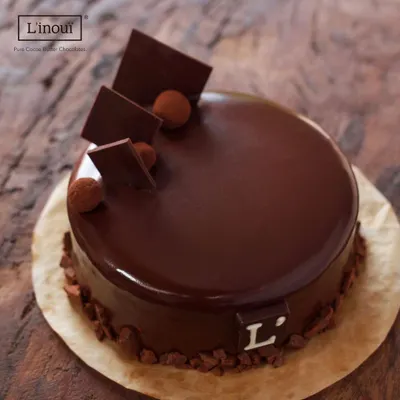A closer look at our signature Belgian Truffle Cake. Notice the deep, glossy sheen of the ganache, a sign of true couverture chocolate. This is the standard of quality you can expect in every cake we bake.