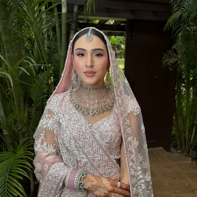 Blush pink perfection for this bride's daytime wedding in Goa. Her soft and romantic makeup look was created to complement her Manish Malhotra lehenga, with an emphasis on glowing skin and delicate pink tones.