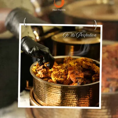Every dish is crafted with care and perfected with passion. Our chef is seen here adding the final touches to a rich, steaming curry in a traditional copper pot, showcasing our commitment to culinary excellence.