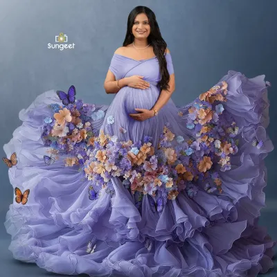One of our most magical creations. This mother-to-be is wearing a custom-designed purple gown that transforms into a cascade of flowers and butterflies, creating a truly unique piece of art.