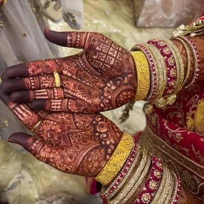 The result of my organic henna after 48 hours. The color has developed into a deep, rich maroon, which looks incredible with bridal bangles.