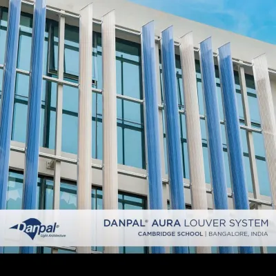 A closer look at the Danpashade Aura Louvers on the Cambridge Junior School. The reflective blue, amber, and opal panels create a dynamic facade that changes with the light, providing both beauty and energy-efficient shading.