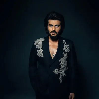 This custom double-breasted black suit by Anamika Khanna is a work of art. The intricate silver embroidery on the shoulders makes it a standout piece for any major event.