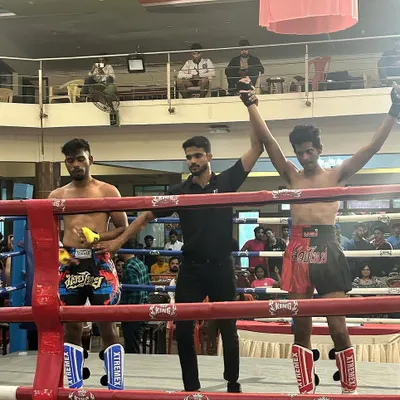 The moment of victory. A fighter's hand is raised after a tough bout, a testament to the countless hours of training and dedication. This is what we strive for.