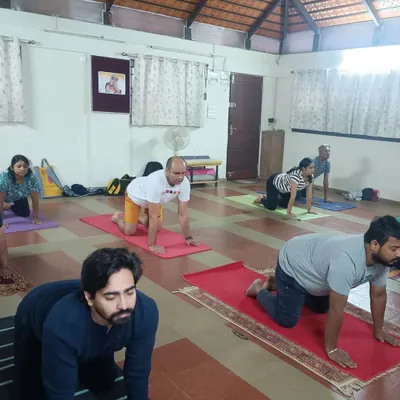 A typical morning class in our Bangalore studio. Participants are seen here in a preparatory posture for Surya Kriya. My focus is always on providing individual corrections and ensuring everyone is aligned correctly to get the most out of their practice.