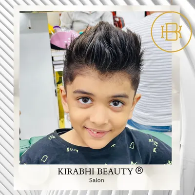 A cool and stylish haircut for this young man. We gave him a modern faux hawk with faded sides, a look that's both fun and easy to manage.