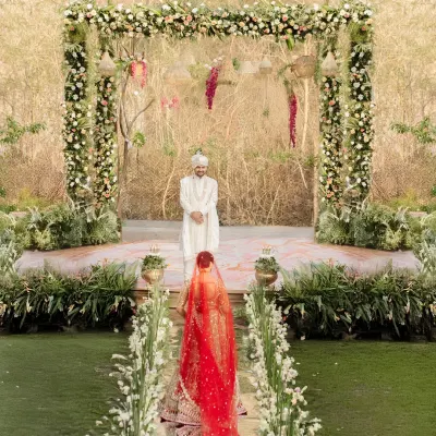 This is a moment of poetry. The bride's entry, as she walks a path lined with flowers towards the man waiting for her, is a story in itself.