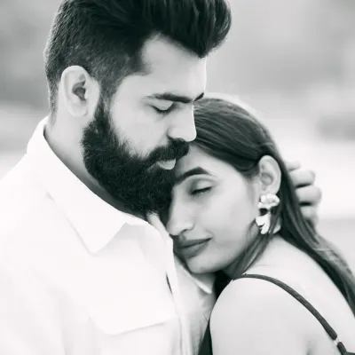A timeless black and white pre-wedding portrait. This intimate shot captures a quiet, tender moment between the couple.