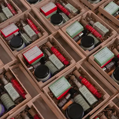 A look inside one of my most comprehensive bulk gift hamper orders. Each wooden crate was filled with a complete skincare routine, including two types of handmade soaps, a rich body butter, coffee-infused undereye roll-on, nourishing lip balm, and more.