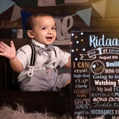 The first birthday is such a joyful milestone. We celebrate it with personalized sessions, like this one featuring a custom milestone board that highlights all of your baby's favorite things. It’s a fun and adorable way to remember their first big year.