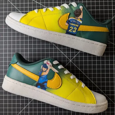 Made for a true fan of the Australian Cricket Team. These custom Nikes feature player portraits and the classic green and gold colors.