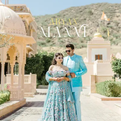Capturing the essence of a royal romance in Pushkar, Rajasthan. The grandeur of the palace architecture perfectly complements the couple's elegant, color-coordinated attire for a timeless pre-wedding portrait.