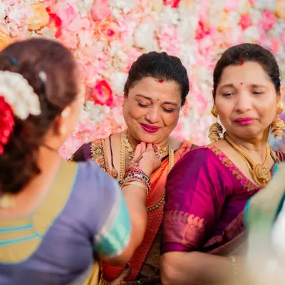 A candid, emotional moment between a mother and daughter at a wedding. It is a privilege to be a part of such special days and create makeup that holds up beautifully through happy tears.