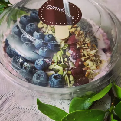 A healthy and delicious start to your day with our berry smoothie bowl, packed with fresh blueberries, nuts, seeds, and cranberries.