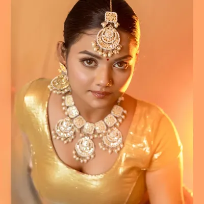 A powerful glamour portrait from our 'Heeramandi' inspired series. The warm lighting and direct gaze capture the essence of a vintage Bollywood star, perfect for a model portfolio or a dramatic personal shoot.